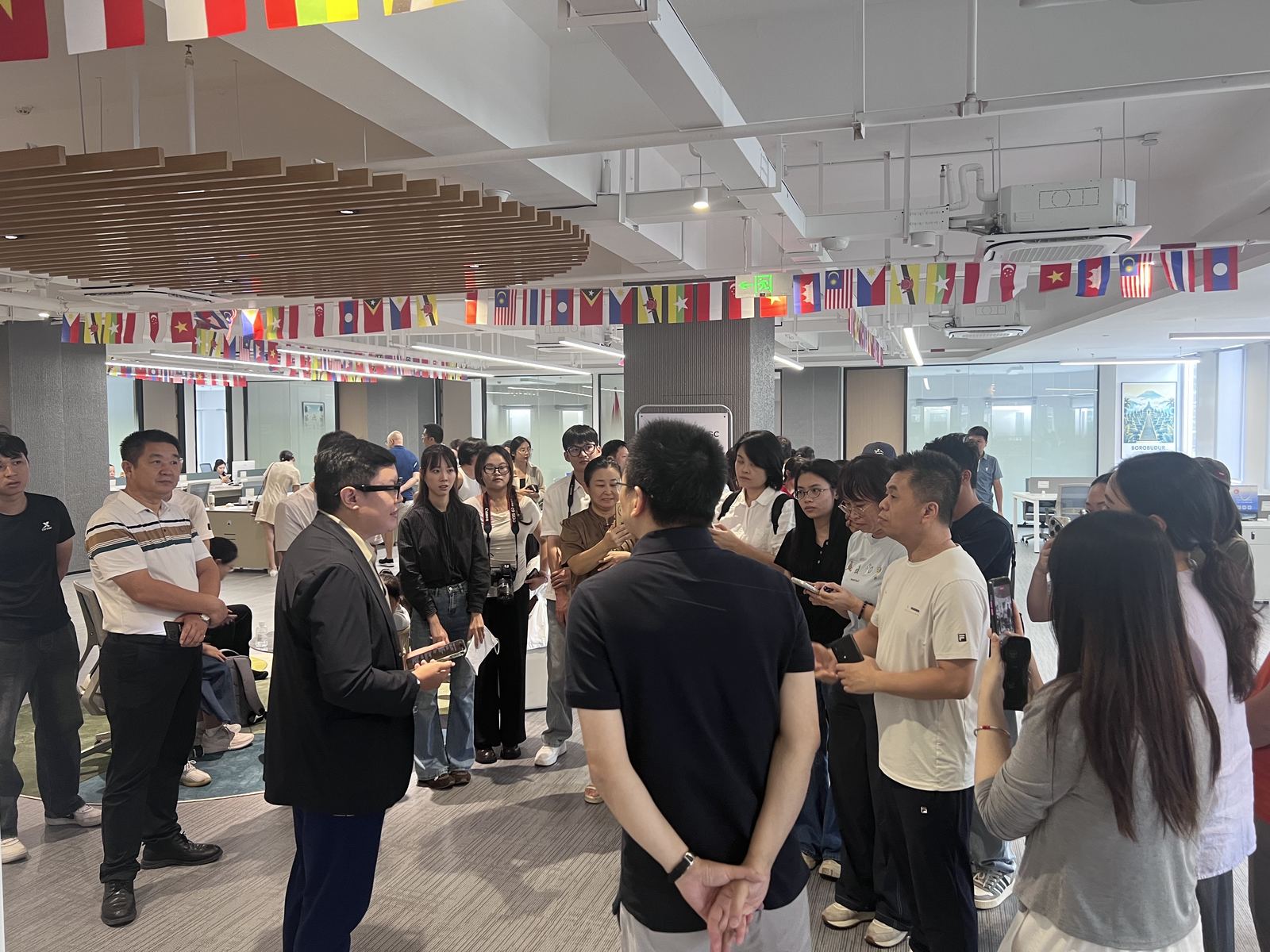 People in discussion during a business visit.