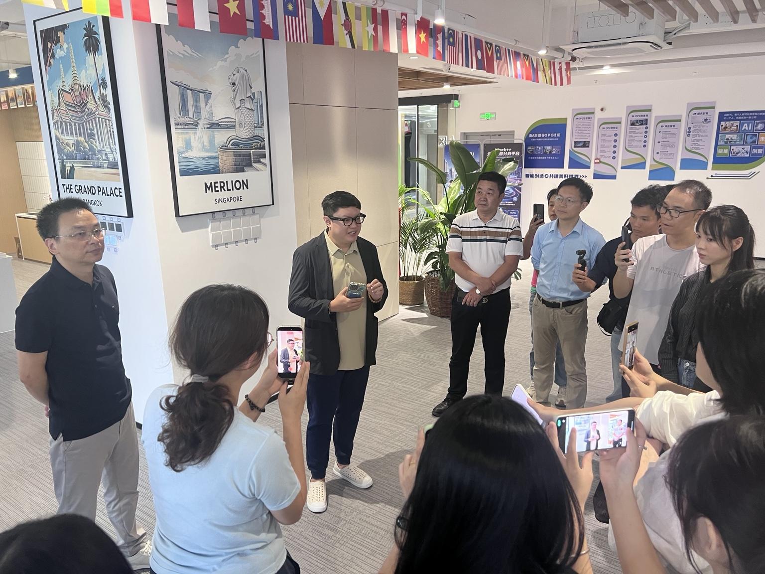Aaron Foo speaking with media representatives during the OPC Community launch